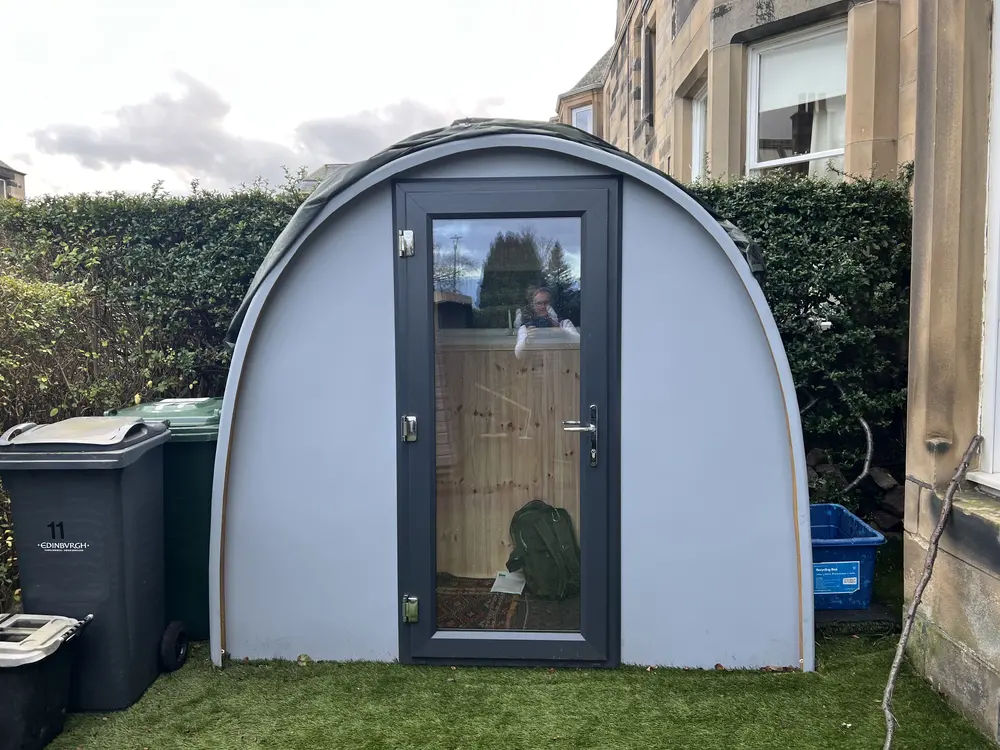 Alexander Holt's grey Dory Office Pod in his front garden