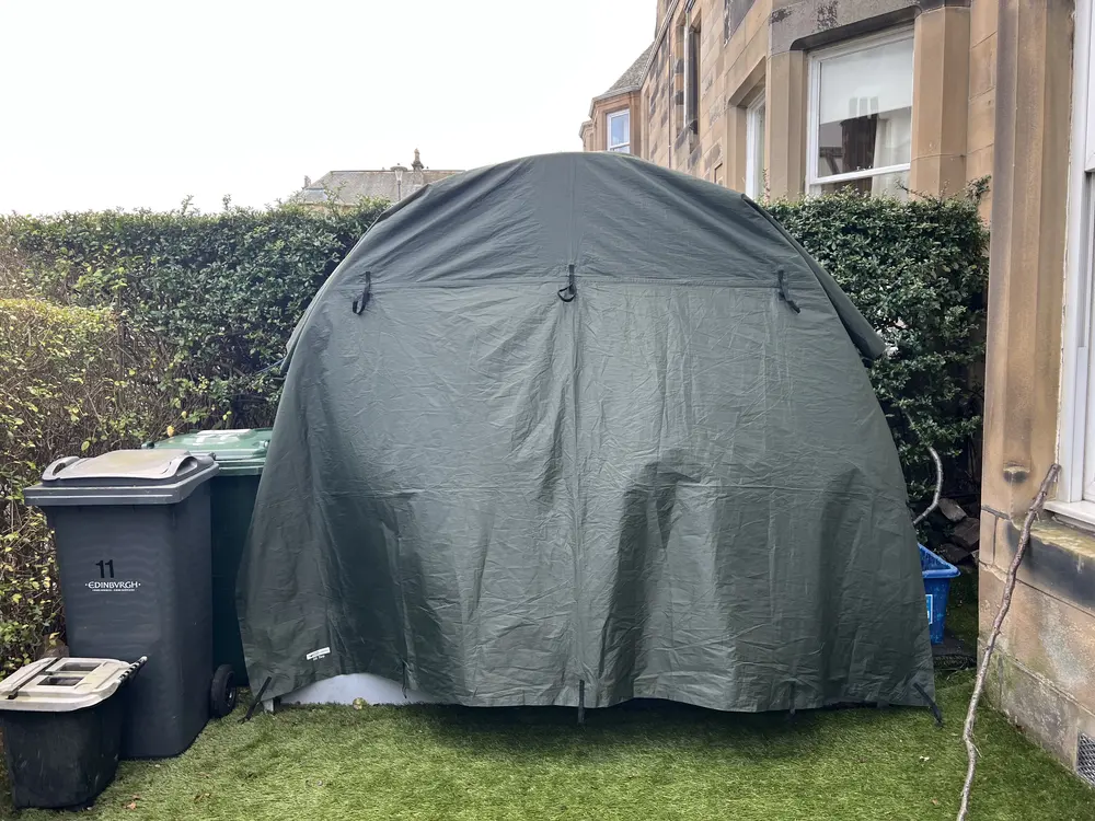 Alexander's Dory Office Pod under a tarp cover to keep it discreet