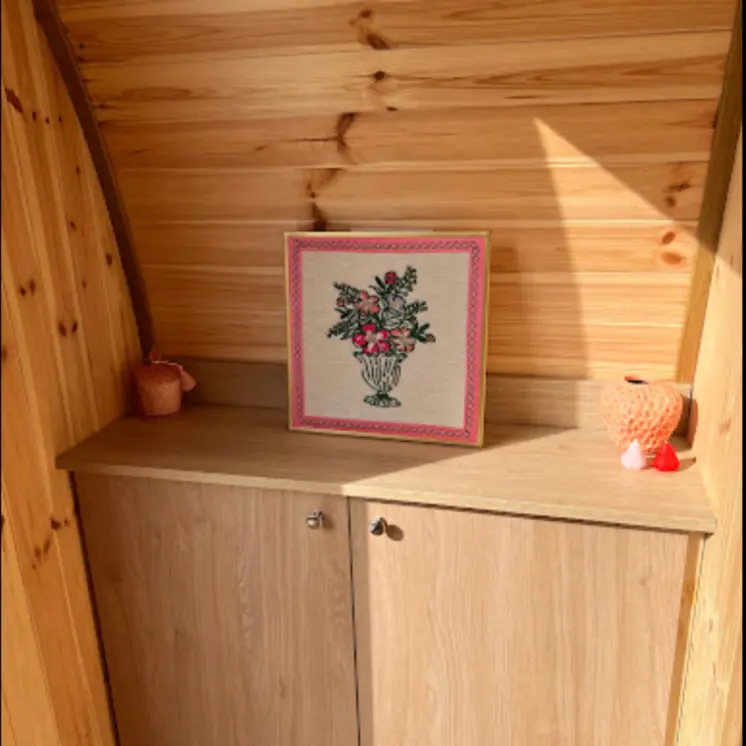 Office garden room with storage for office supplies and a shelf for decor.